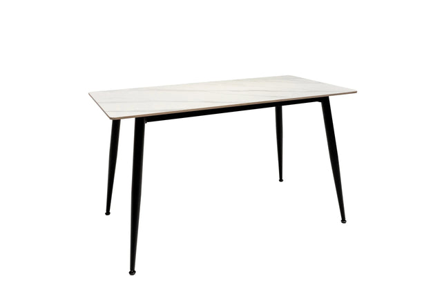 Rectangular white dining table with slim black legs and marble-effect top