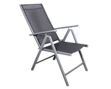 Grey metal folding garden chair with mesh seat and backrest angled to the side