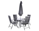 Grey outdoor dining set with glass table, four mesh chairs and closed patio umbrella