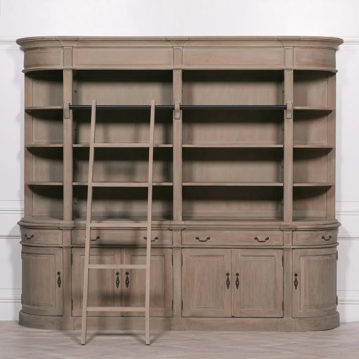 Large wooden bookcase with open shelves, lower cupboards, and attached ladder
