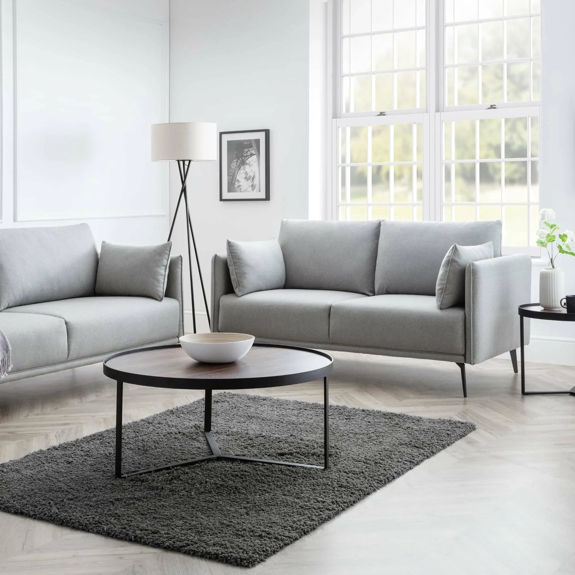 Light grey 2 seater and 3 seater sofas with black legs in modern living room