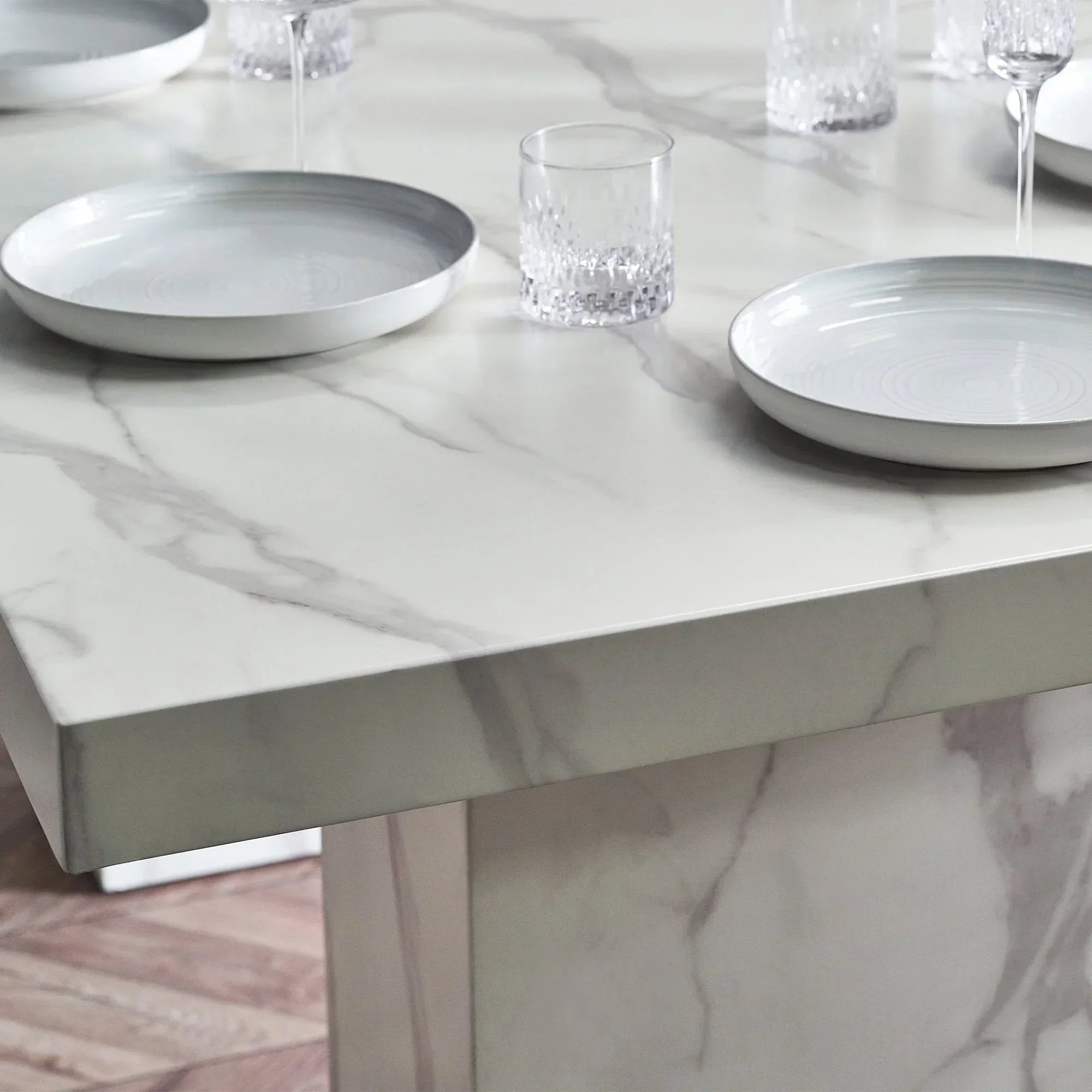 Rome white marble effect dining table corner with plates and glasses