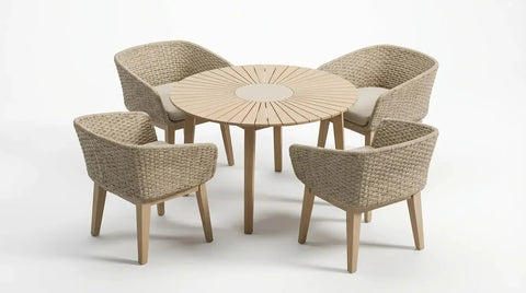 Four seater round dining table set with woven rattan chairs and padded seats