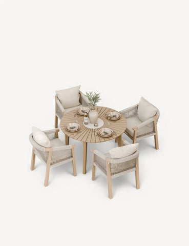 Modern round wooden dining table set with four rope accent chairs and cream cushions