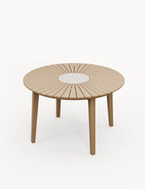 Round wood dining table with slatted top and stone center accent, four legs