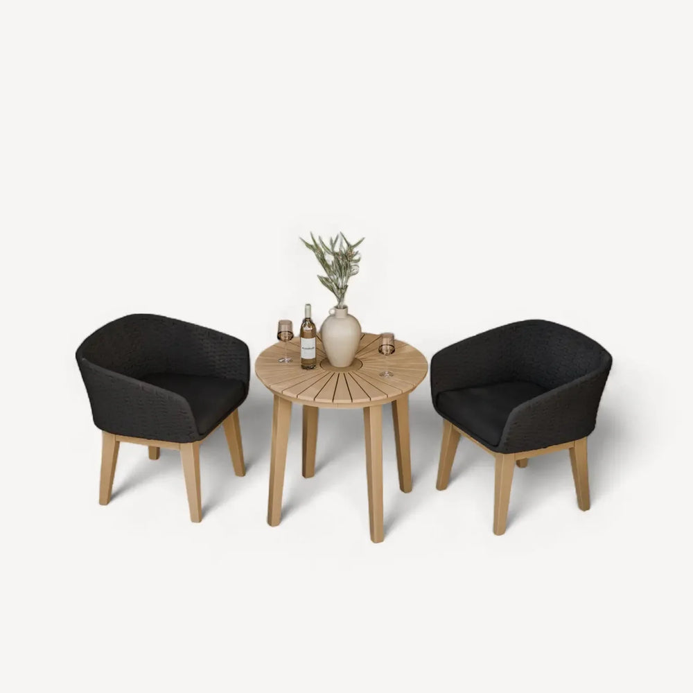 Rattan garden bistro set with two black chairs, round wooden table and decor accents