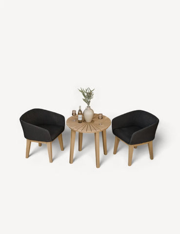 Rattan garden bistro set with two black chairs, round wooden table and decor accents