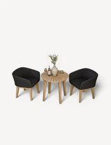 Rattan garden bistro set with two black chairs, round wooden table and decor accents
