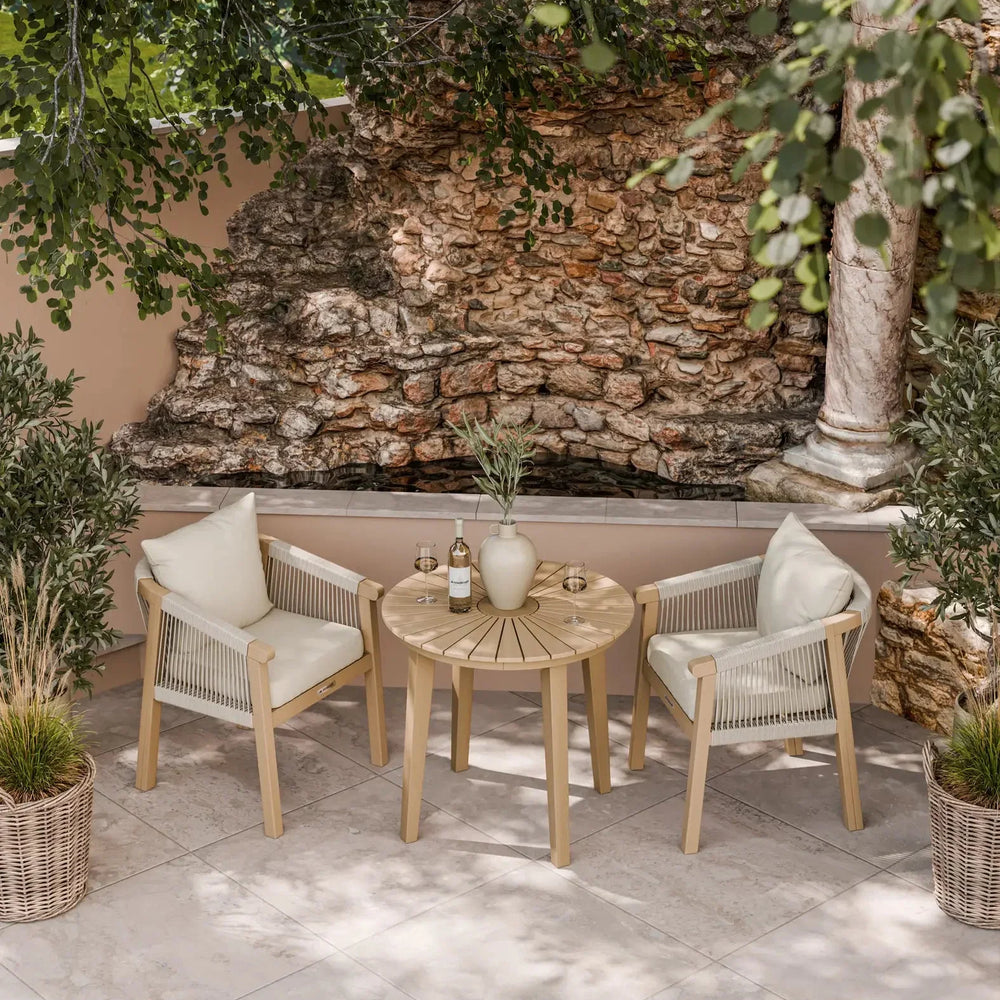 Outdoor garden bistro set with round table and two rope chairs on tiled patio