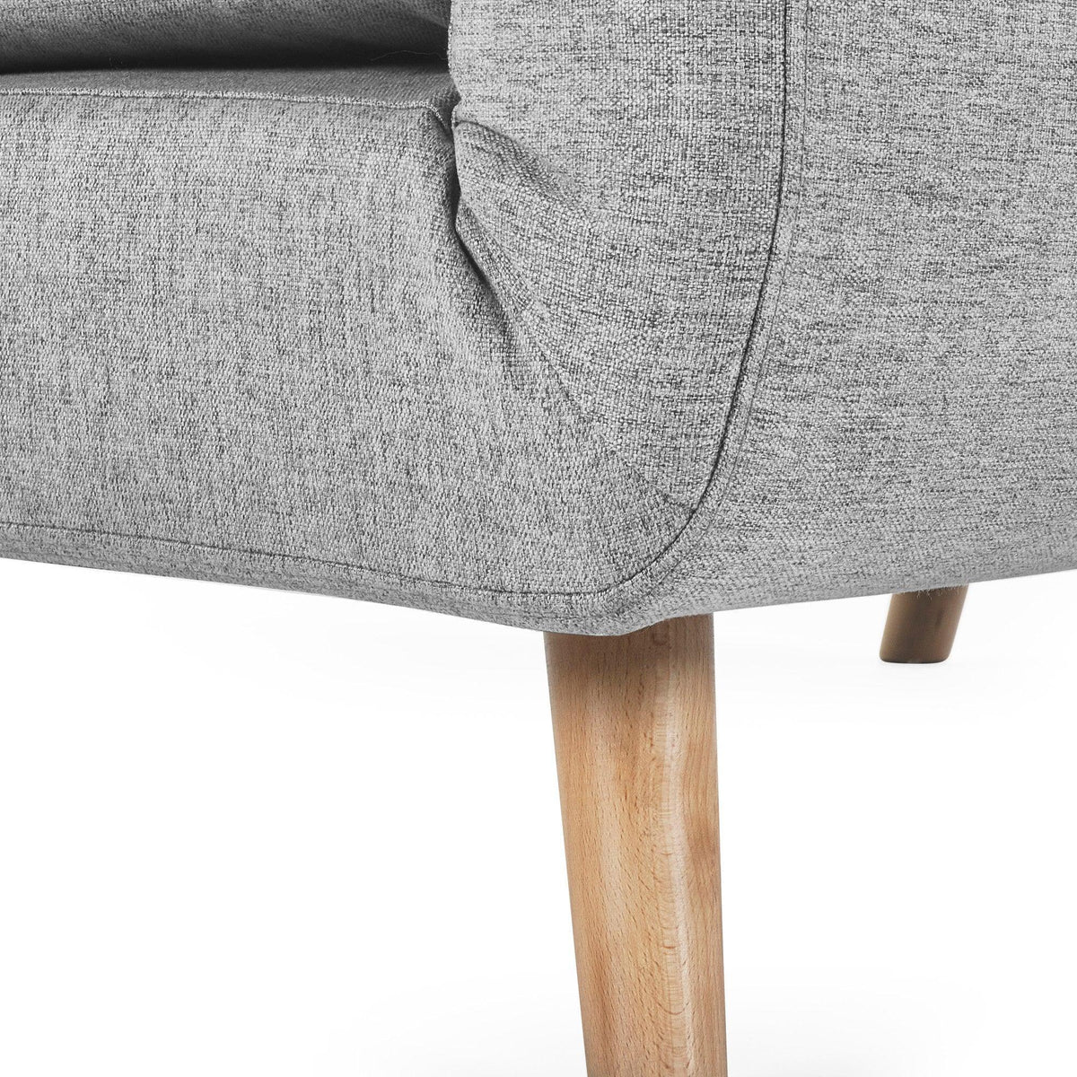 Grey single sofabed corner detail with wooden legs and textured fabric upholstery