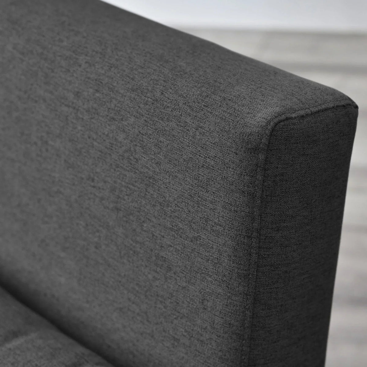Close-up of Rowan single sofabed armrest in mid grey fabric upholstery