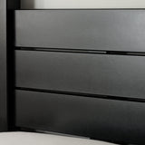 Close-up of black wooden canopy bed footboard with metal bolts and smooth finish, on a textured rug
