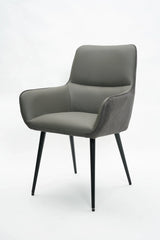 Grey leather dining chair with armrests and slim black metal legs on white background