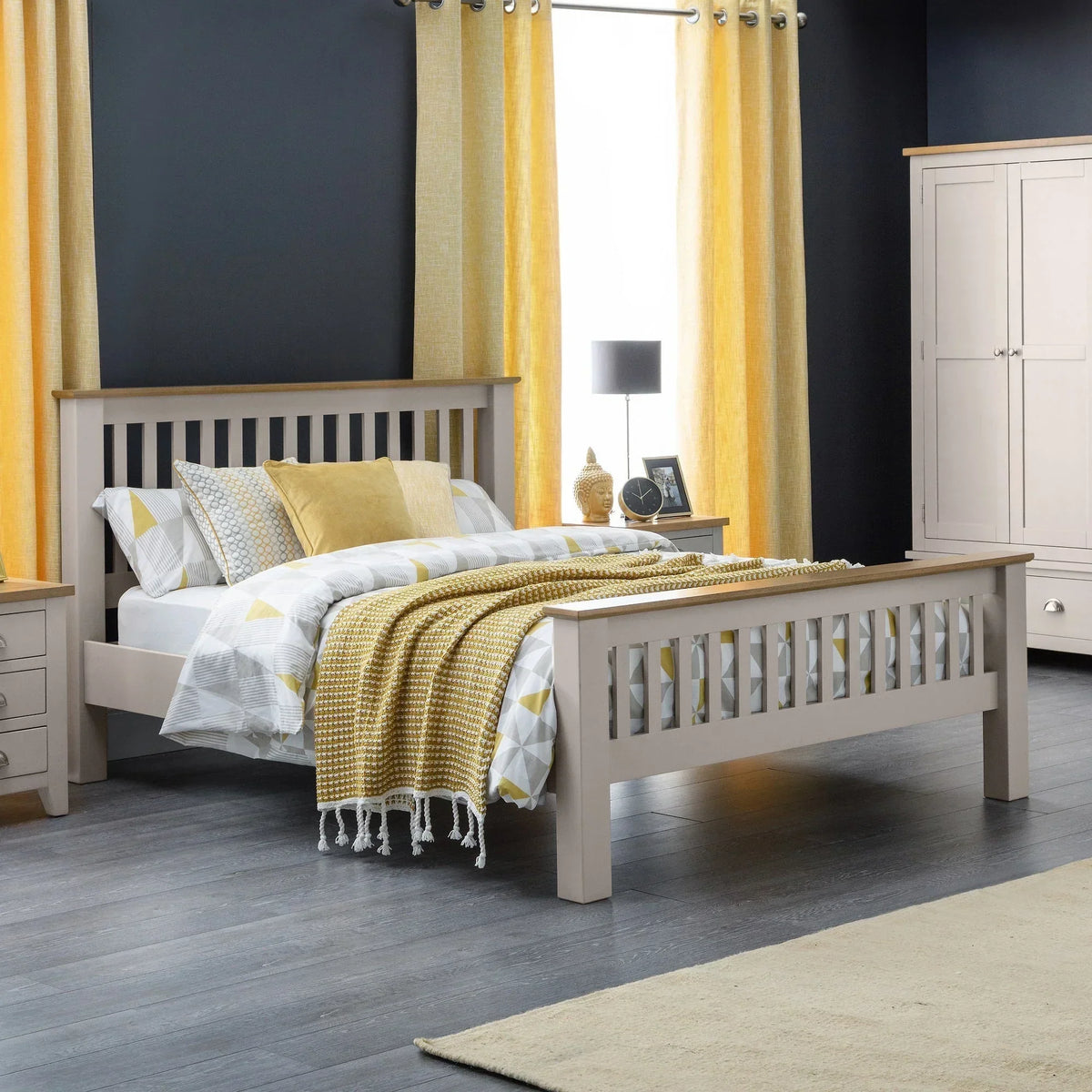 Neutral wooden bed frame with slatted headboard in modern bedroom with yellow curtains