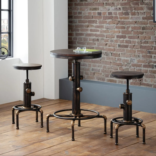 Industrial bar table and stools set with metal base and wooden tops in loft interior
