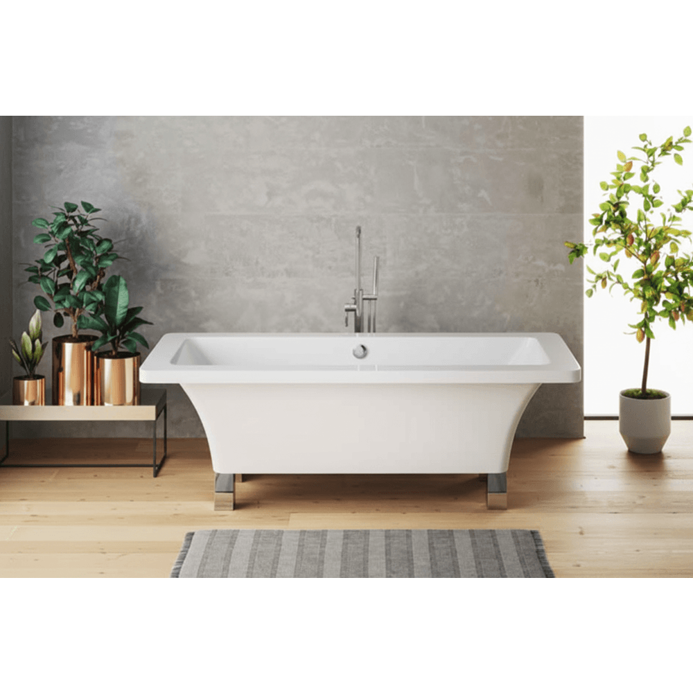 Modern freestanding bathtub in a bathroom with plants and a gray wall.