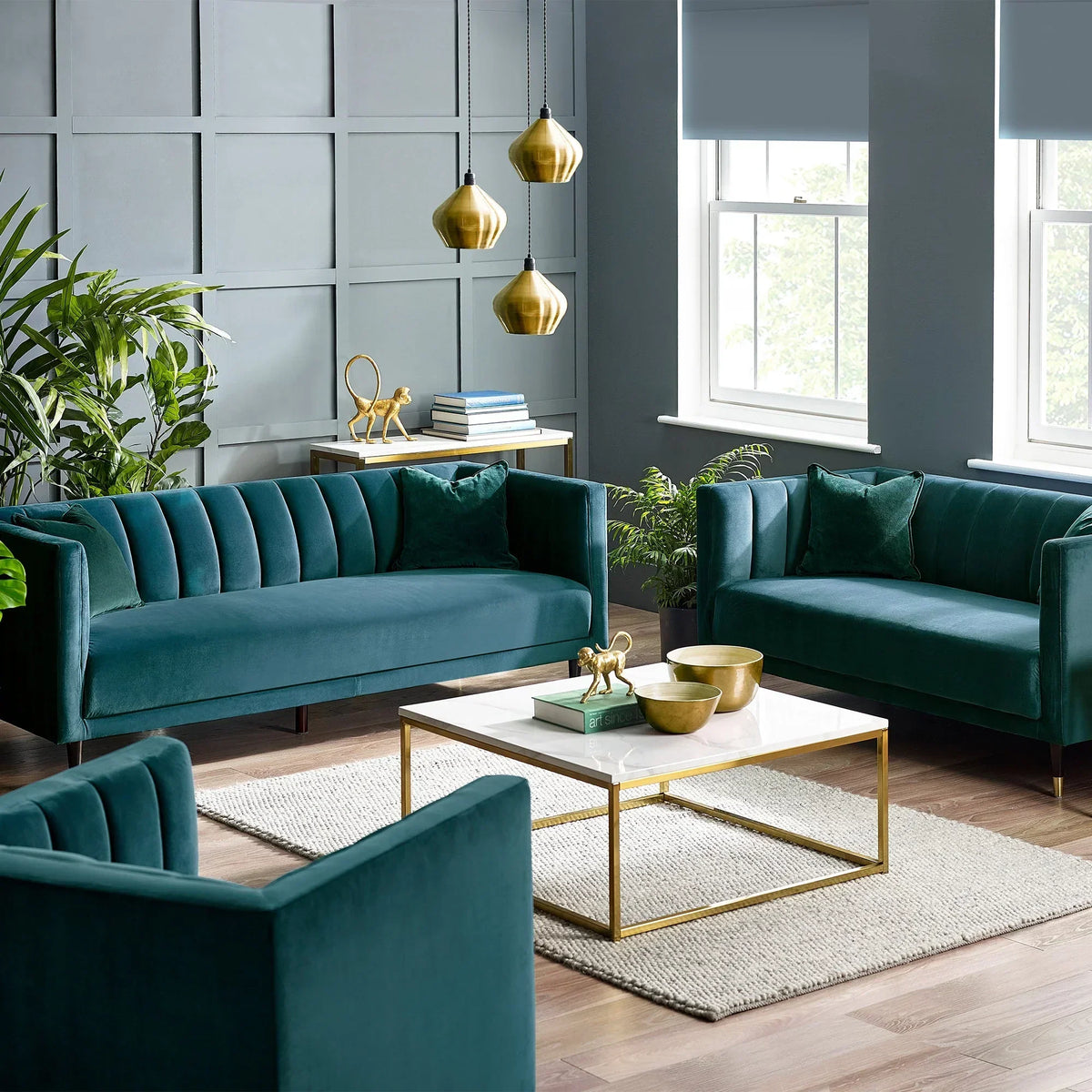 Teal velvet scalloped back 3 seater sofa in modern living room with gold accents