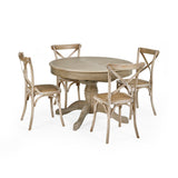 Four light wood dining chairs with woven seats arranged around a round dining table on white background