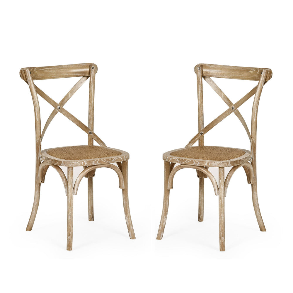 Two light wooden dining chairs with cane seats placed side by side on white background