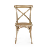 Side profile of light wooden dining chair with cane seat on white background