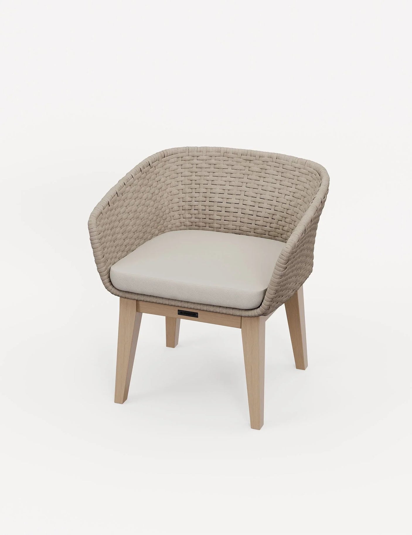 Woven rattan dining chair with light wooden legs and padded cream seat cushion