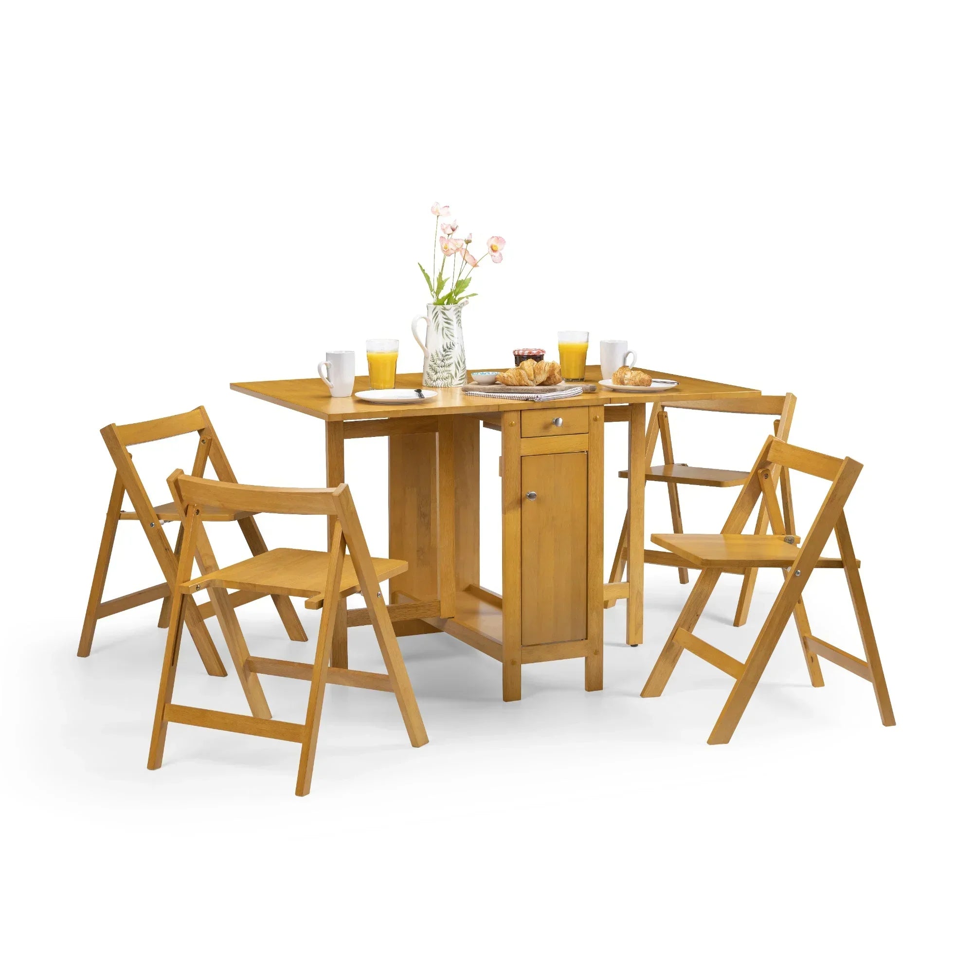 Light oak dining set with foldable chairs and storage table, set for breakfast