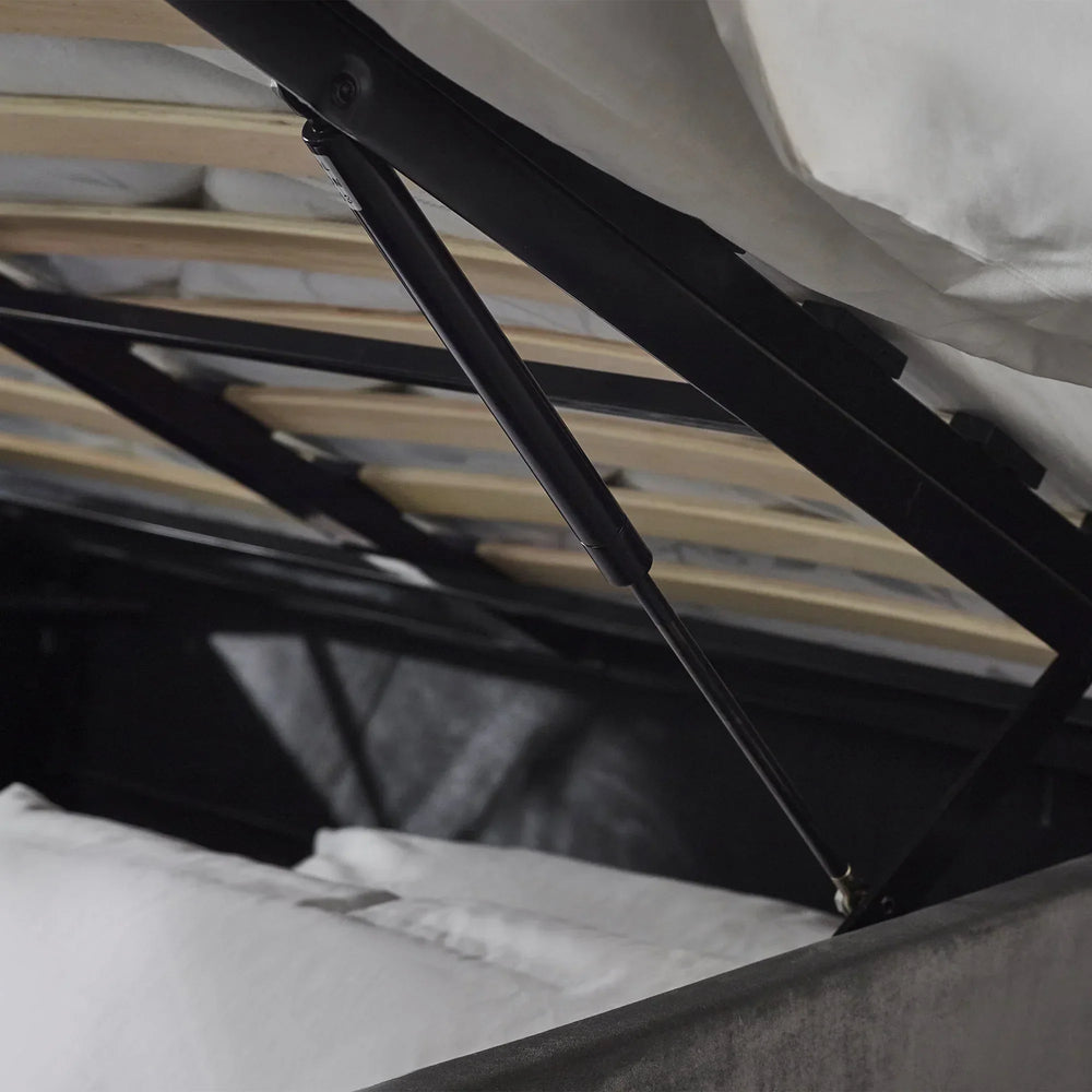 Lift-up storage bed gas lift mechanism and slatted base in close detail