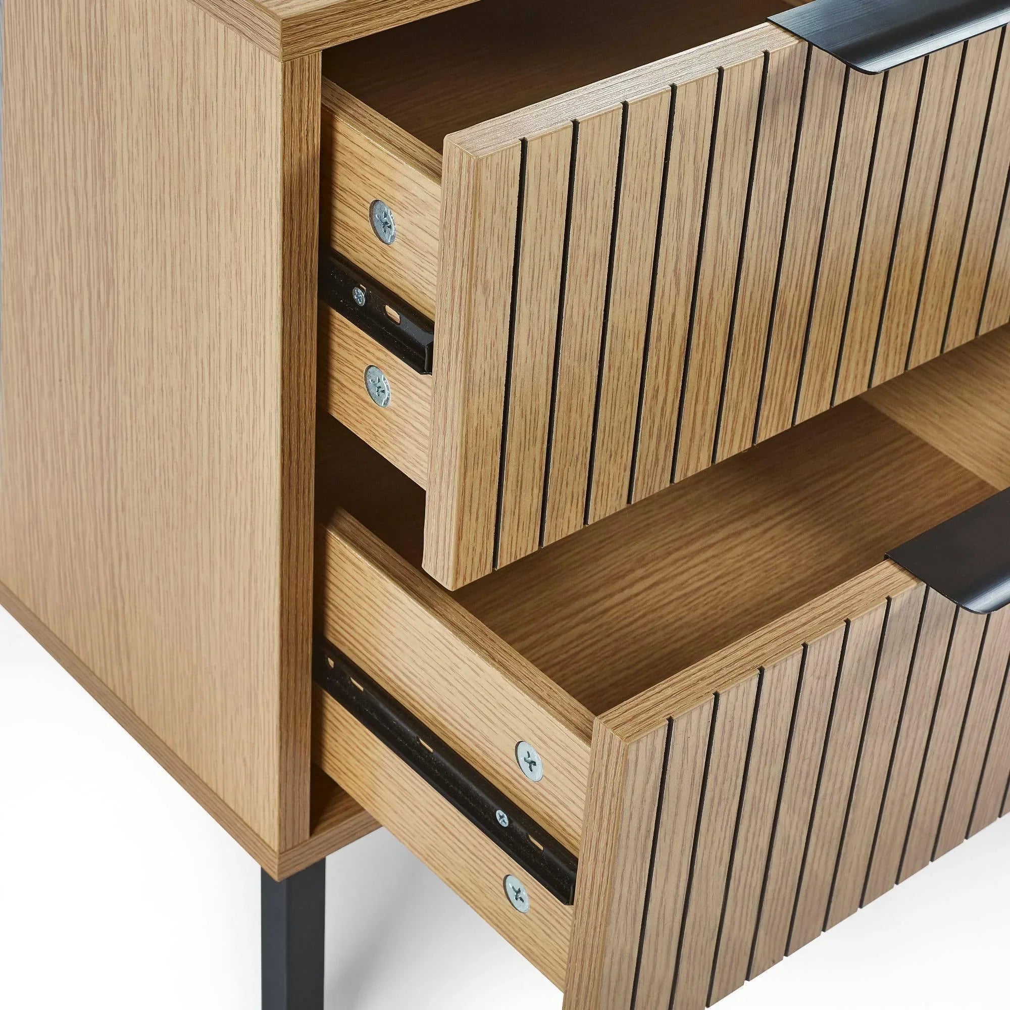 Oak wood chest of drawers with black metal handles and vertical slat front detail