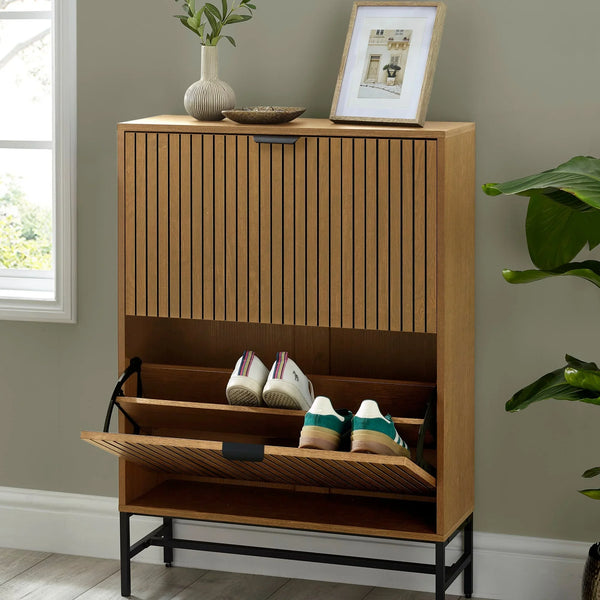 Wood shoe storage cabinet with slatted doors, pull-down compartment and two pairs of trainers