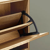 Close up of wood shoe cabinet with open tilting shelf and black support mechanism