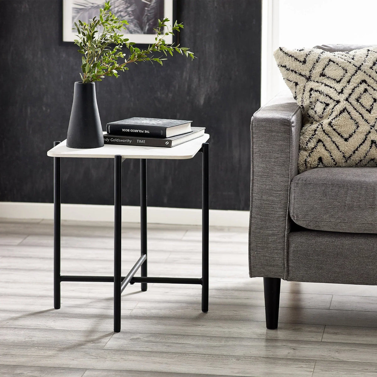 Siena sintered stone square lamp table with black legs beside grey sofa and decorative cushion