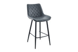 A modern bar stool with a dark gray quilted faux-leather seat and backrest, supported by slim black metal legs and a footrest, shown against a plain white background.