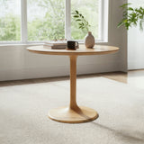 Wooden side table with a vase and mug in a room with large windows.