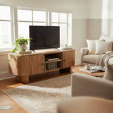 Modern living room with wooden TV stand, beige sofa, and decorative items.