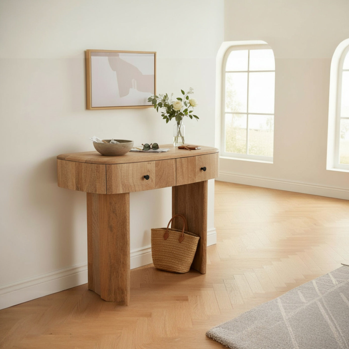 Wooden console table in a room with a window and decor items.