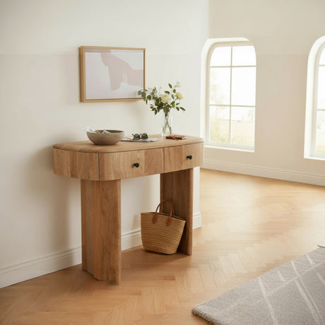 Wooden console table in a room with a window and decor items.