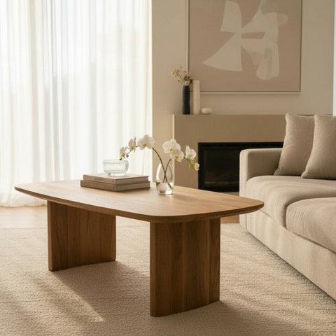 Modern living room with a wooden coffee table, beige sofa, and abstract art on the wall.