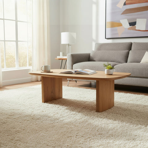 Living room with a wooden coffee table, gray sofa, and abstract painting on the wall.