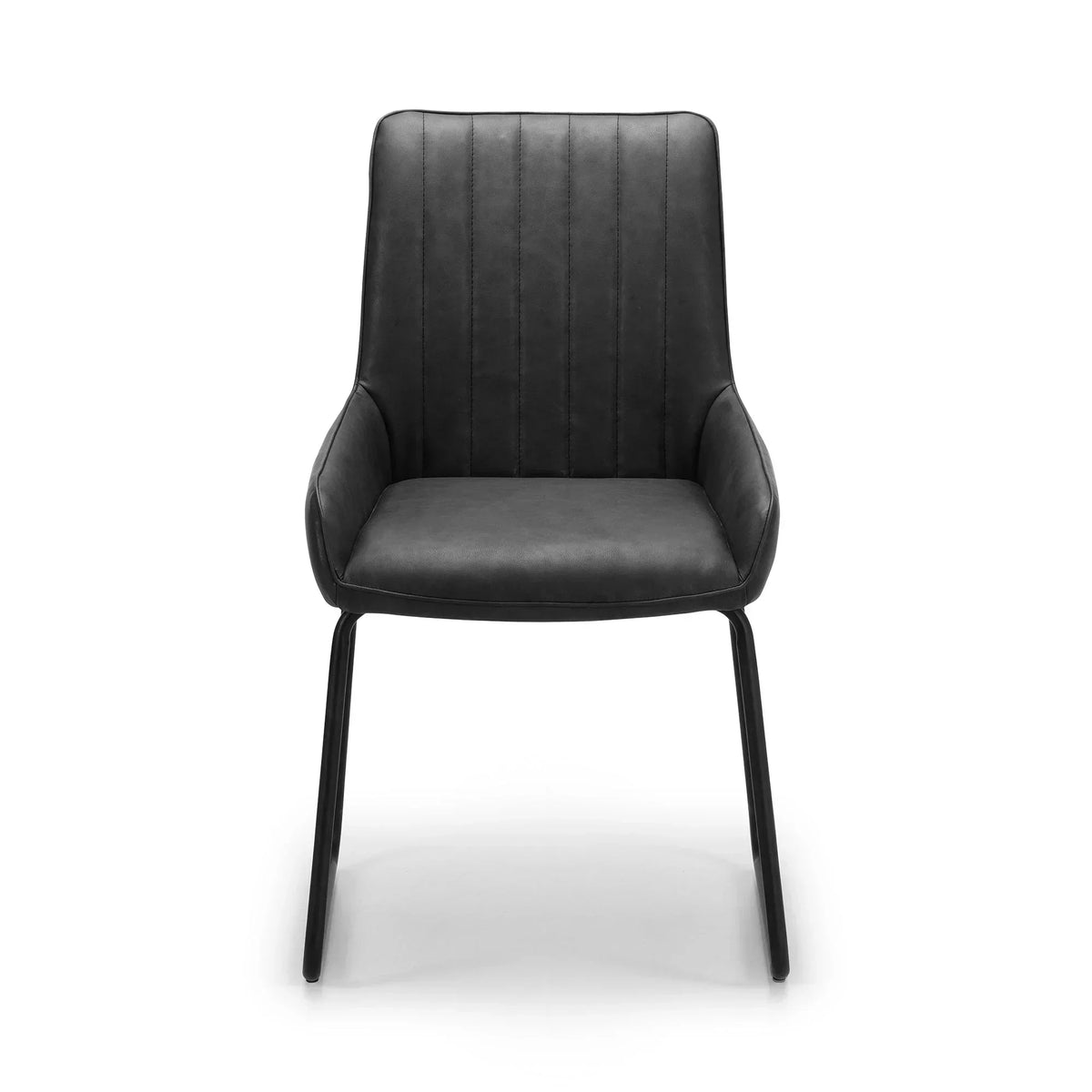 Antique black dining chair with padded seat, metal legs, and vertical stitched detail