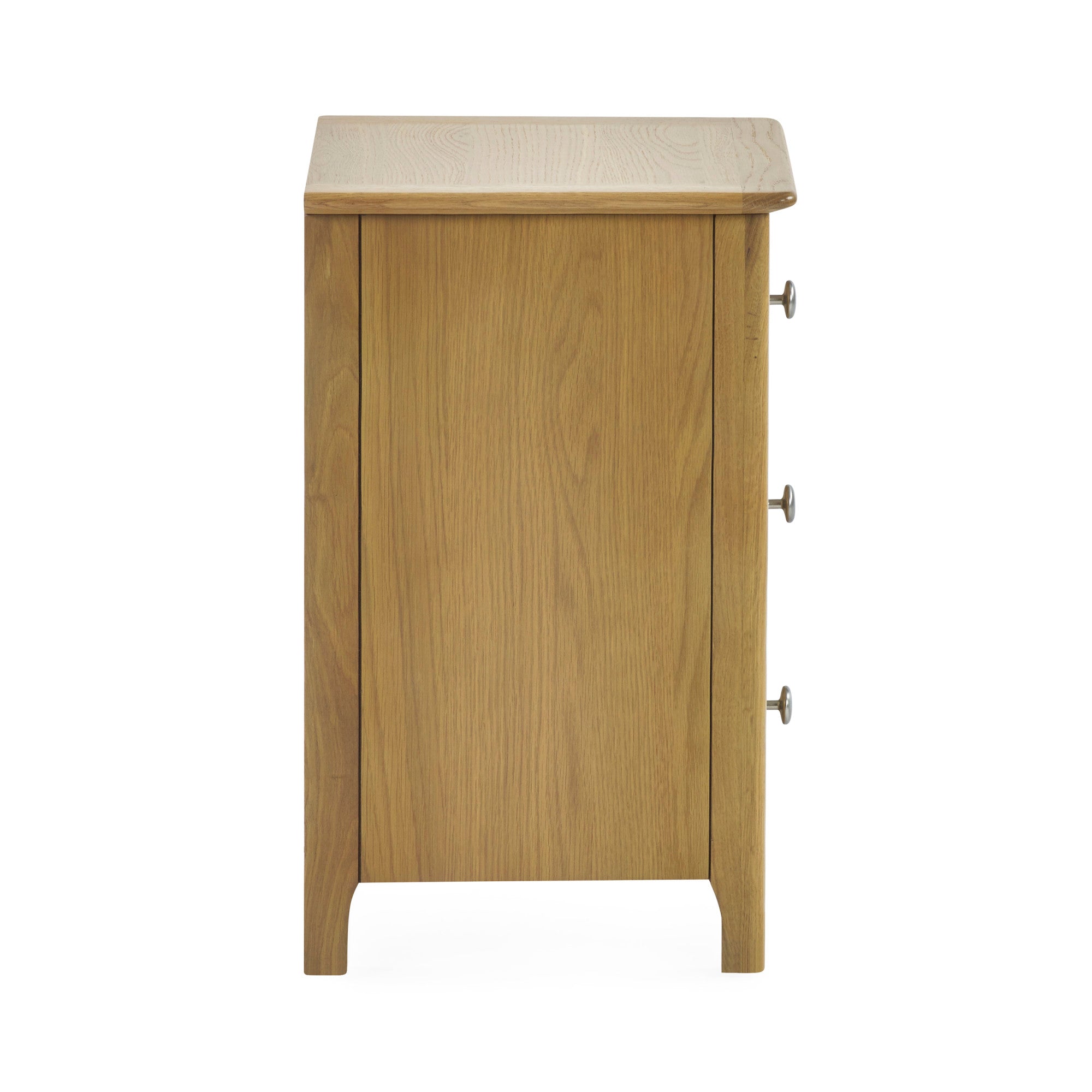 Close-up of the bedside table's bottom left leg and side panel in light oak