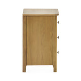 Close-up of the bedside table's bottom left leg and side panel in light oak