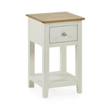 Cream painted bedside table with oak top on white background, drawer closed, angled front view