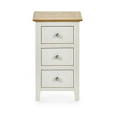 Cream colored 3 drawer bedside with oak top front view against white background, showing metal knobs