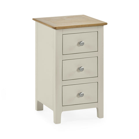 Beige 3 drawer bedside with natural oak top, rounded edges, and round metal knobs on white background