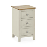 Beige 3 drawer bedside with natural oak top, rounded edges, and round metal knobs on white background