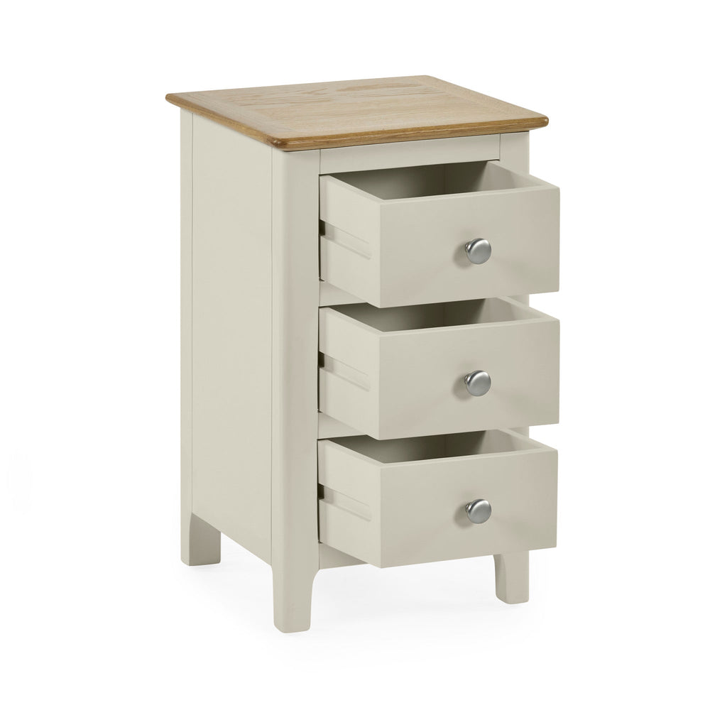 Light grey 3 drawer bedside cabinet with natural wood top and silver round knobs, drawers open front angle