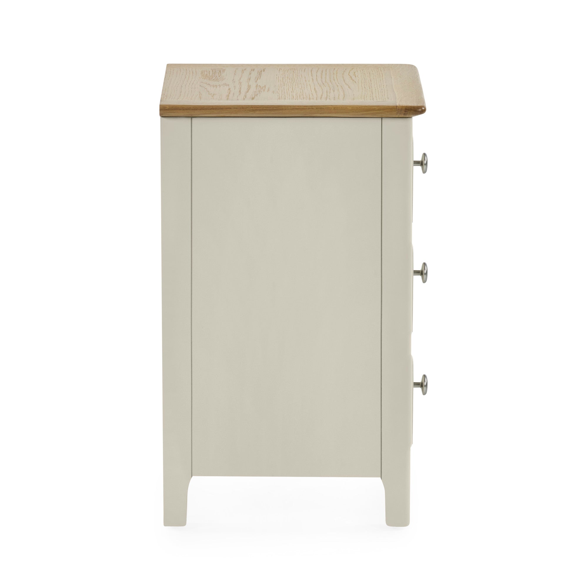 Side view of light grey bedside table showing flat panel design, natural wood top and silver drawer knobs