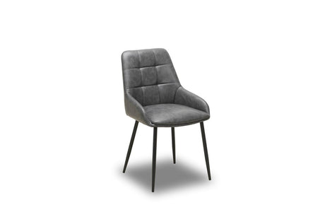 A modern gray upholstered dining chair with a tufted backrest and slim black metal legs, shown on a plain white background.