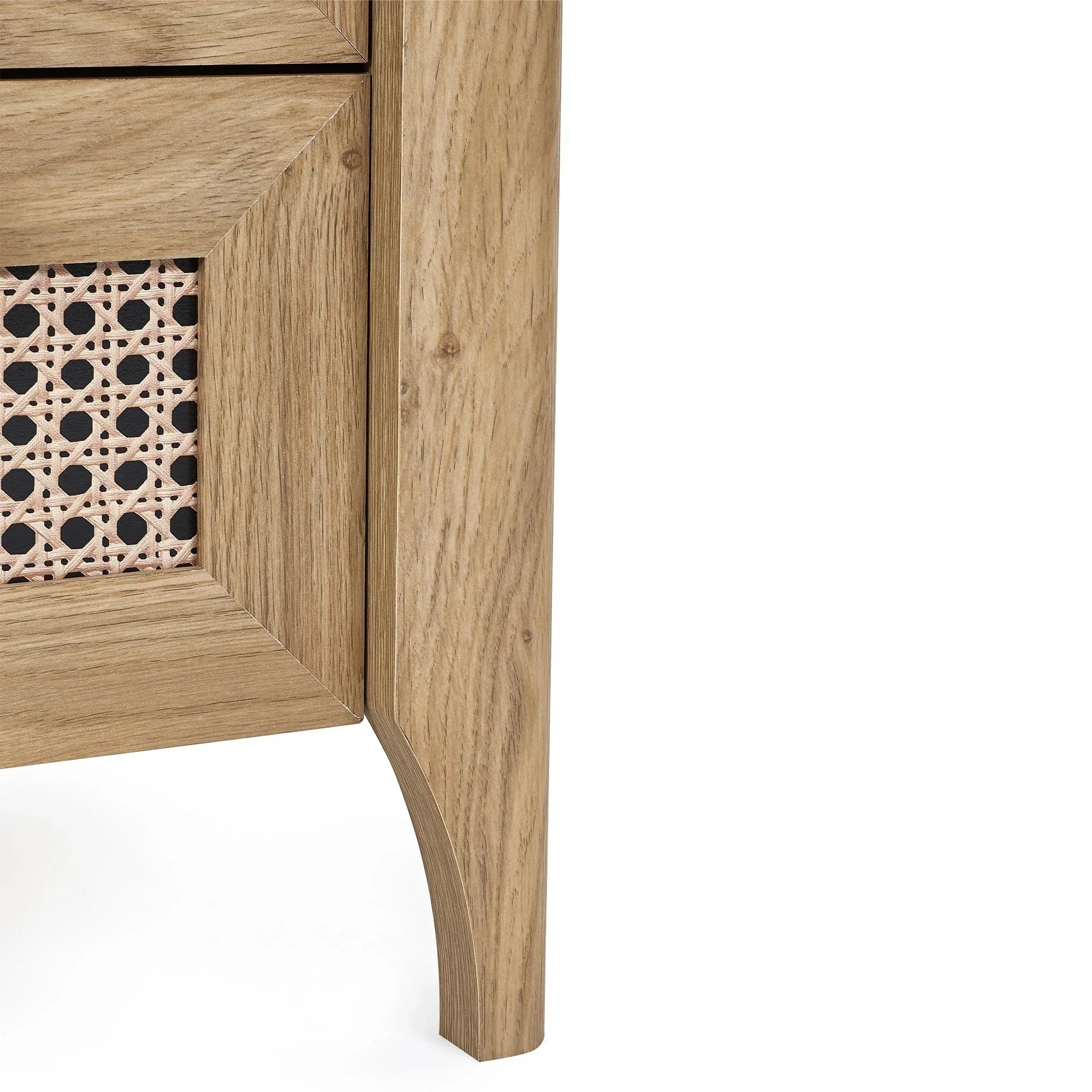 Close-up of rattan effect bedside table corner with oak wood finish and woven drawer detail