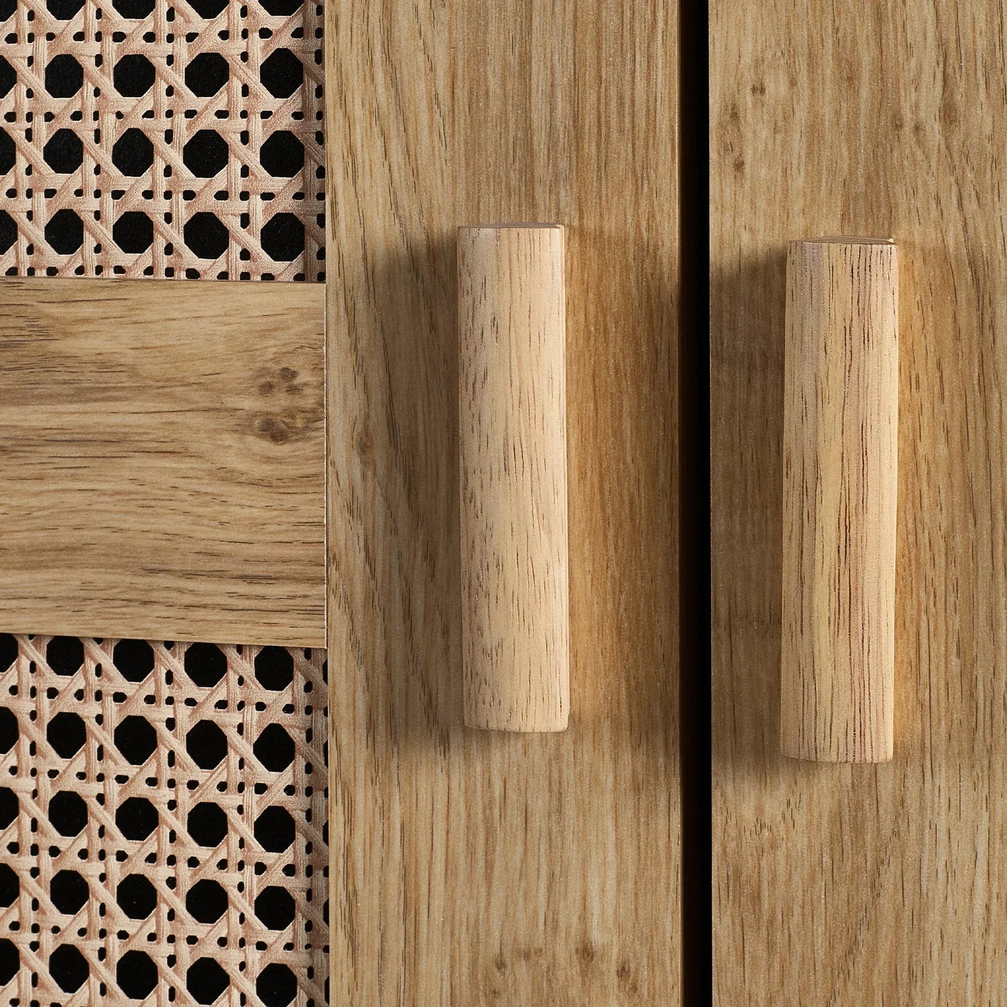 Closeup of rattan effect wardrobe door with wood handles and oak finish panel